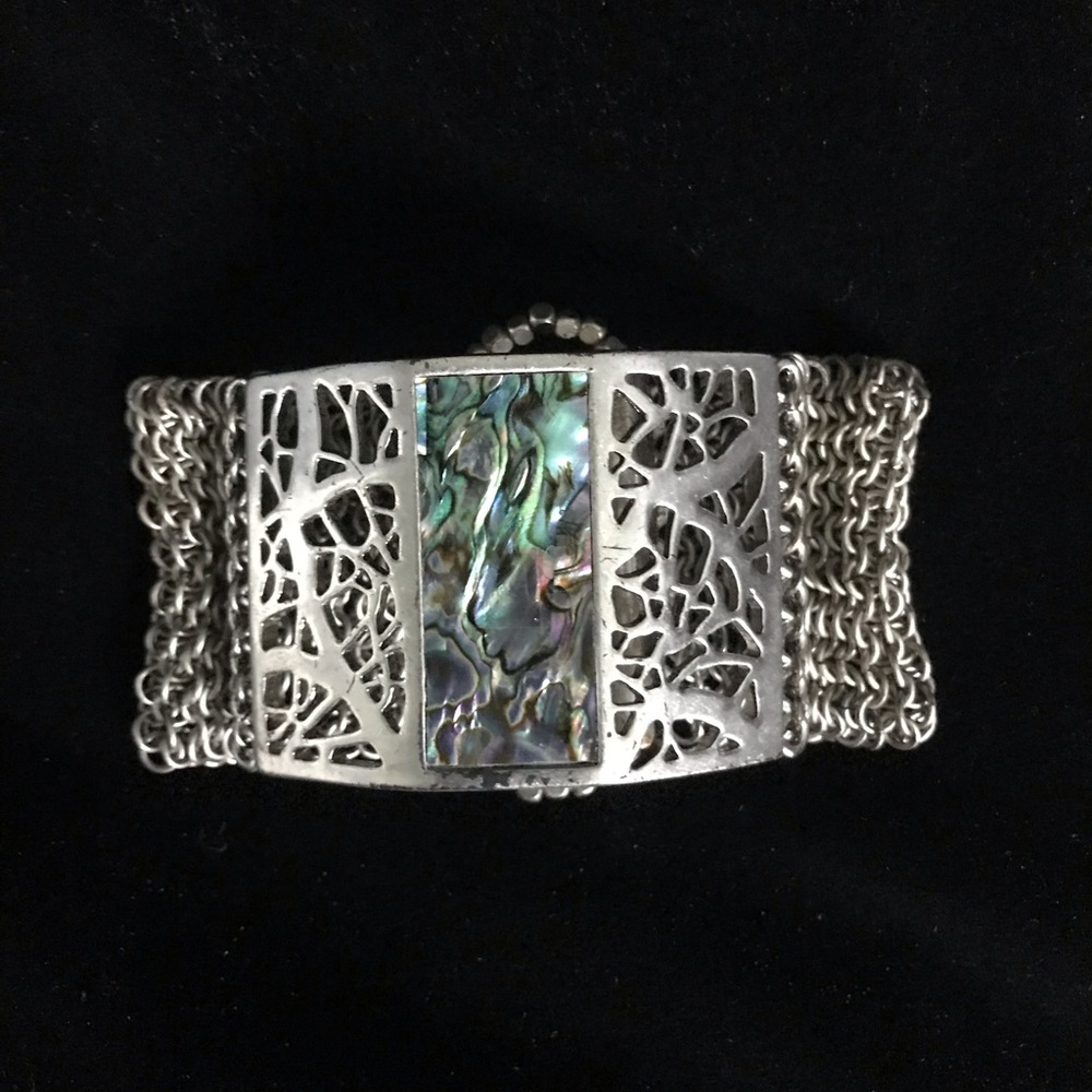 Kenneth Cole bracelet / earring set. Silver